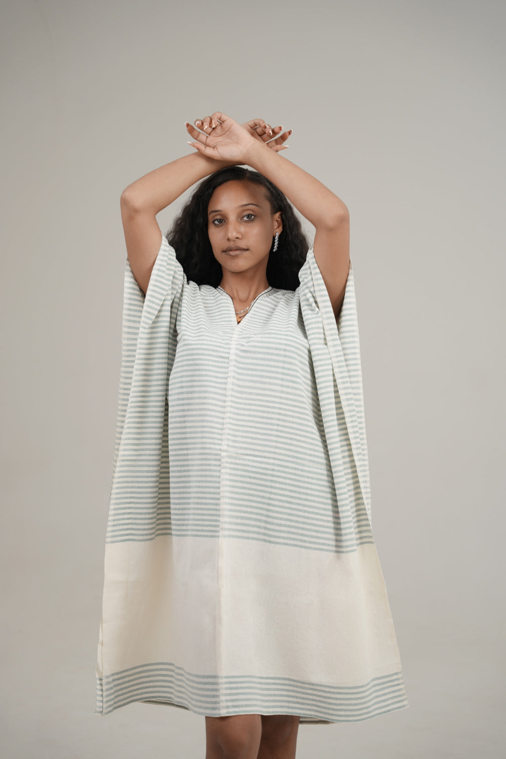 Ari kaftan in flax on ethiopian model and grey background