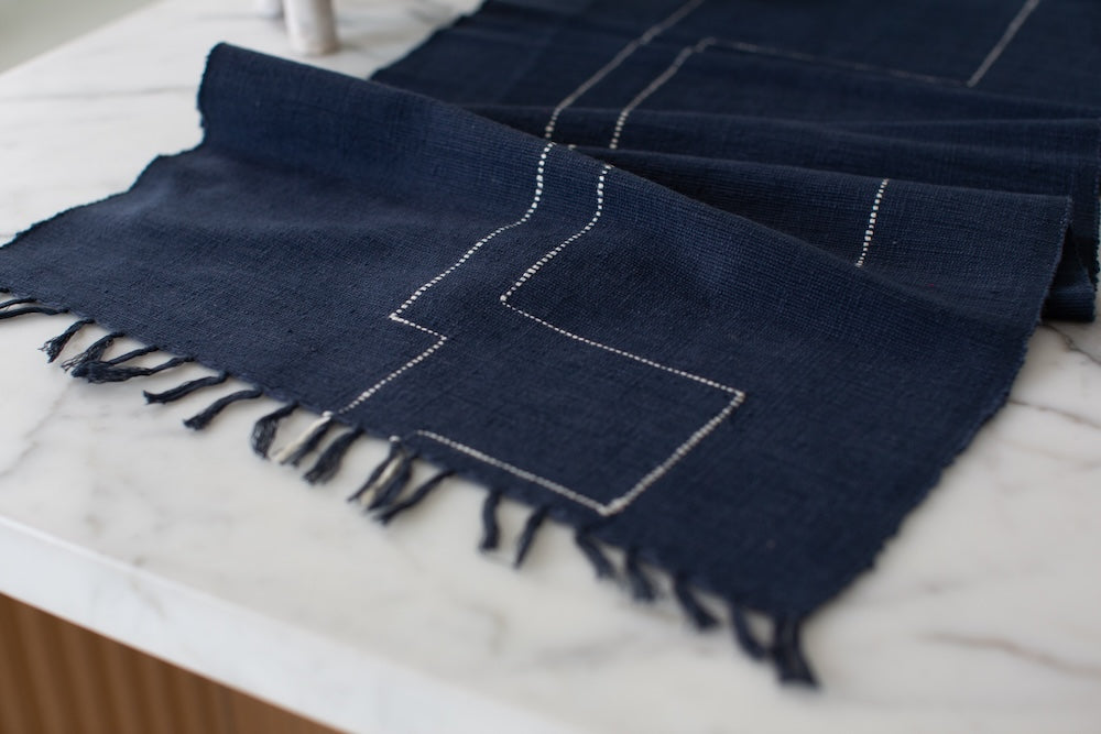 Close upon Rift Valley table runner navy on a table