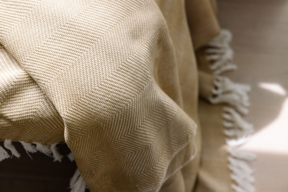 Mechot throw blanket in beige close up