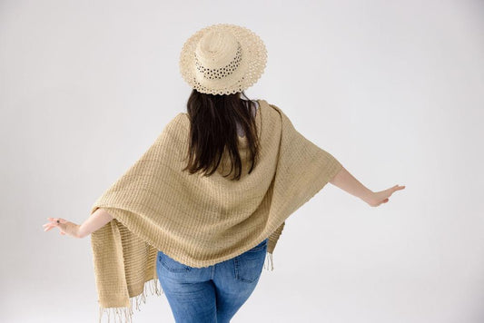 Queen Saba pure silk shawl on a female model from the back.
