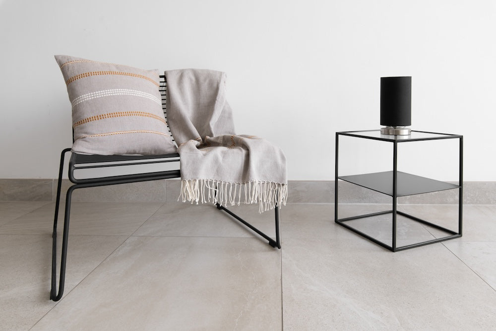 Stone Zenach cushion and throw on a chair