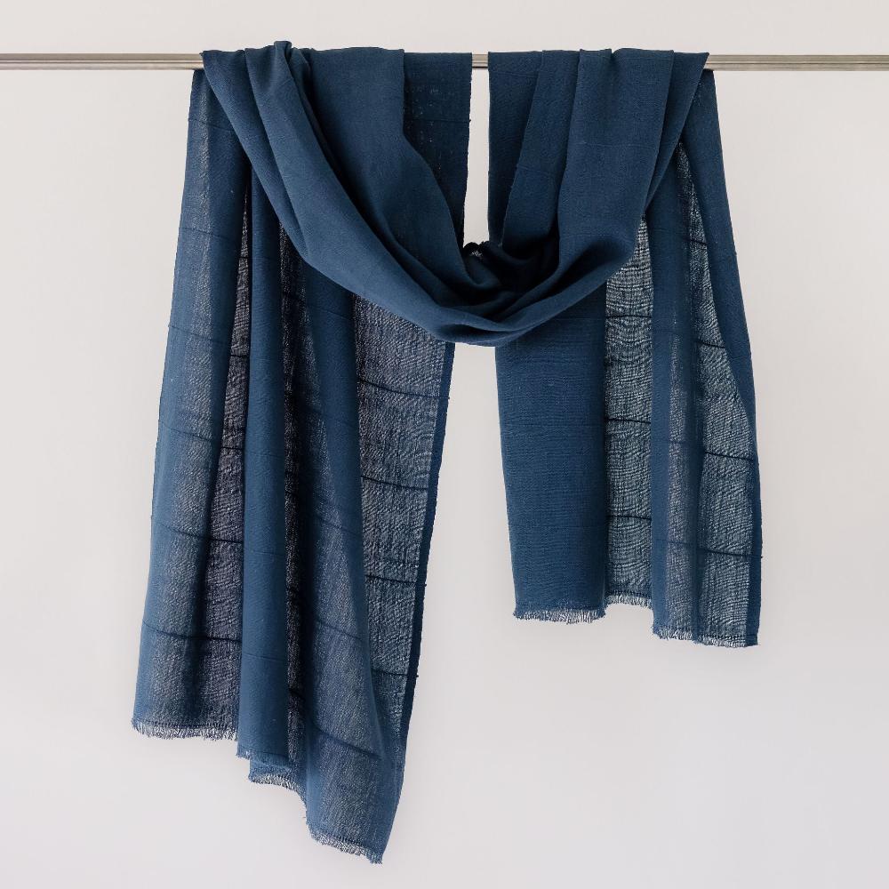 maraki shawl in navy on bar with white background