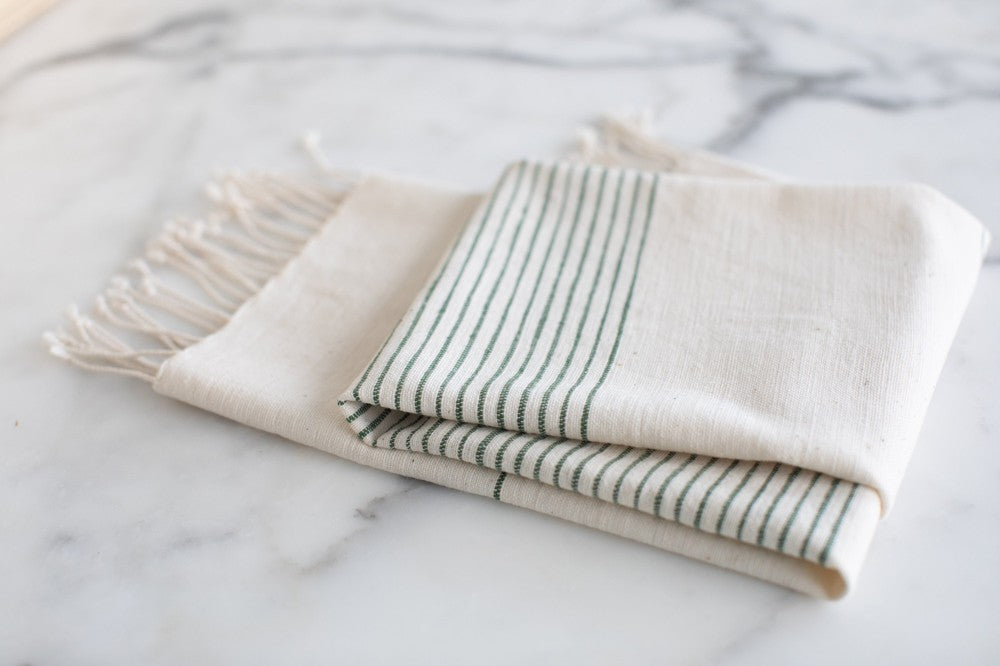 Roha kitchen towel in cedar on marble background