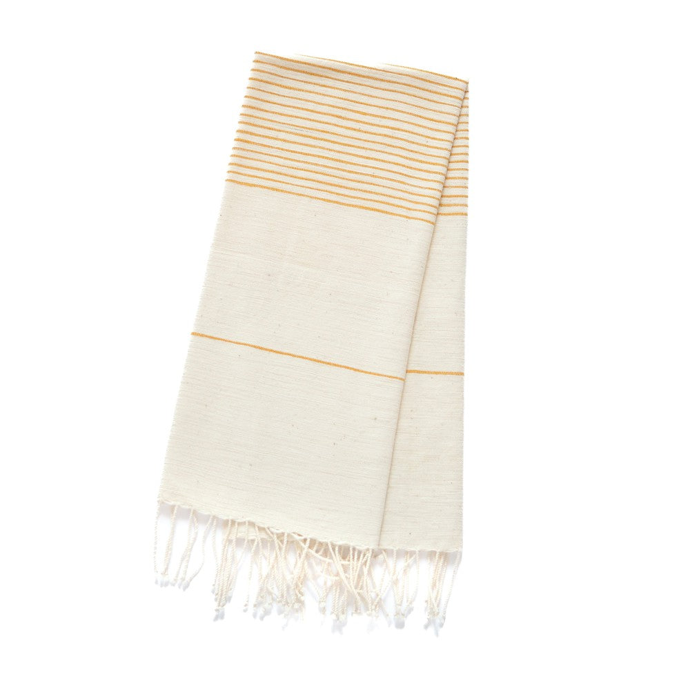 Roha kitchen towel in gold flat lay on  white background