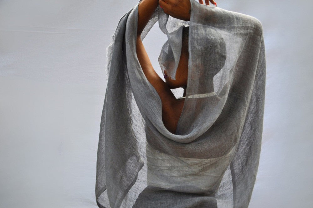 Telba shawl in charcoal on a model from behind.