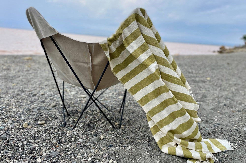 Omo beach towel in moss on camping chair at the beach