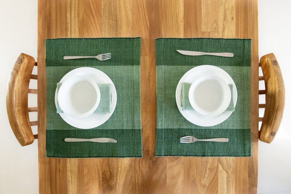 Two Sodo placemats in cedar on wooden table