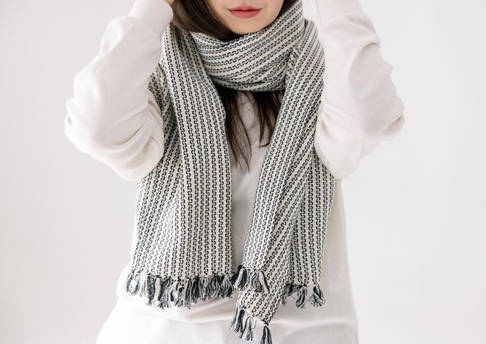 Aaron scarf wrapped around a female model