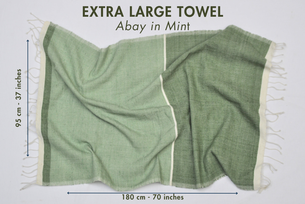 Abay extra large towel with measurements on a white background