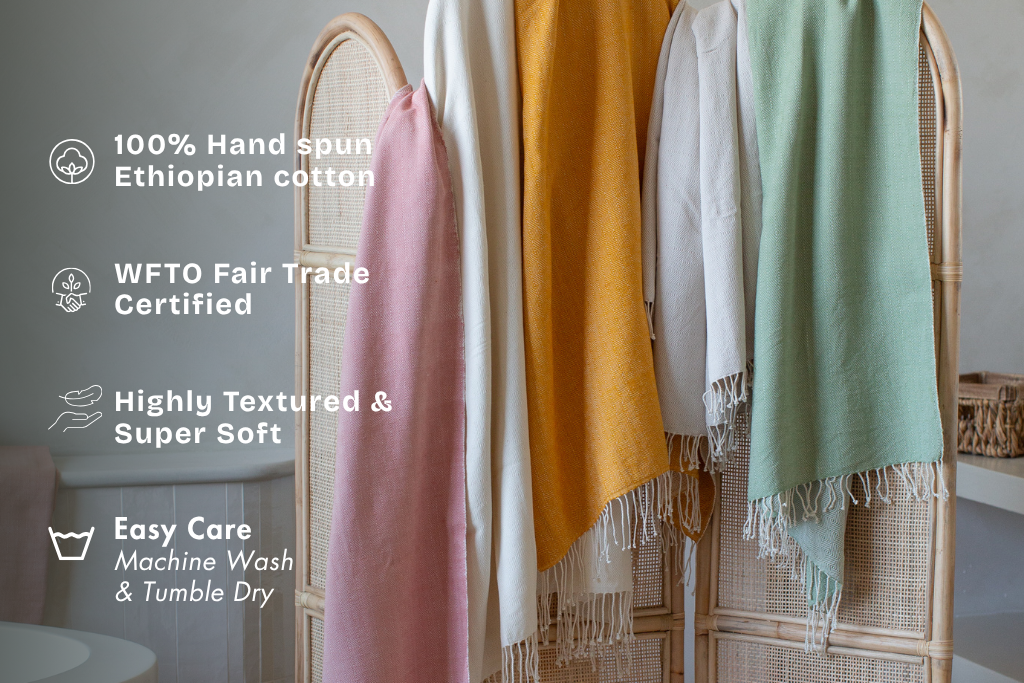 Almaz bath towels hanging in bathroom with key features