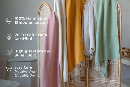 Almaz bath towels hanging in bathroom with key features