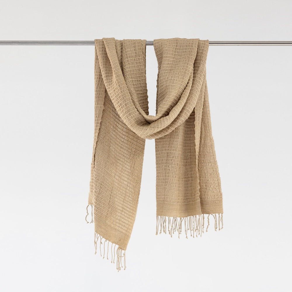 Beige Queen Saba shawl on bar