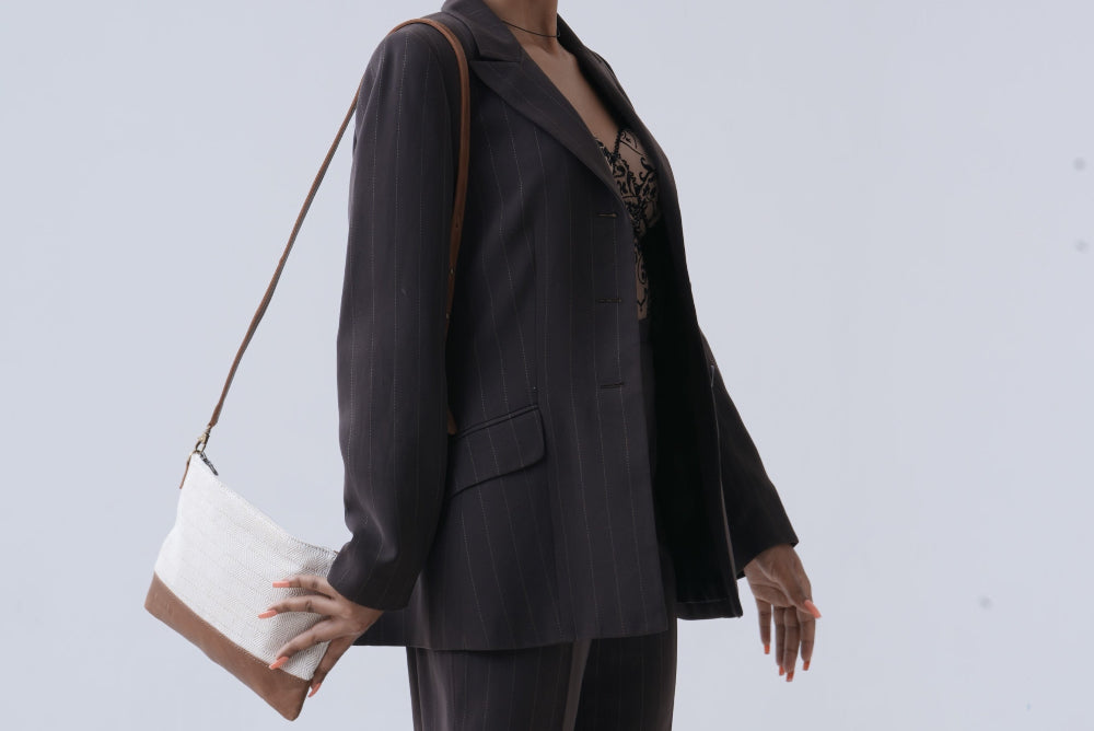 Beige cross body bag on a model