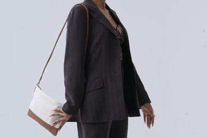Beige cross body bag on a model