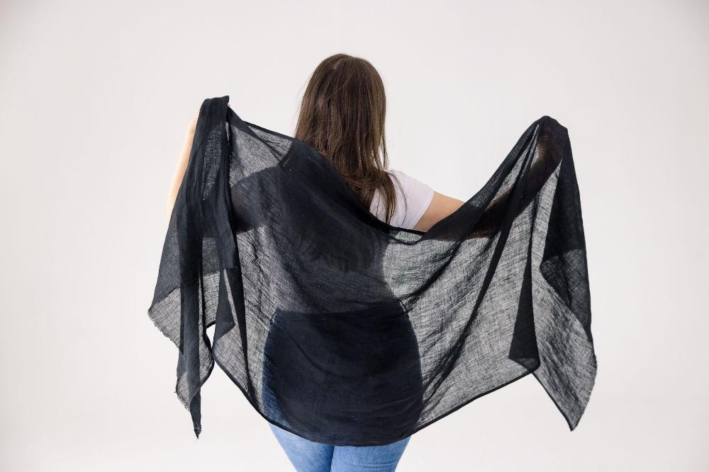 Black linen shawl on a model from behind.