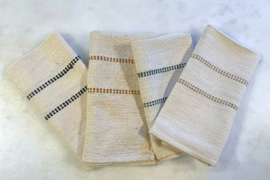 Chamo napkins in almond, bronze, black and cedar