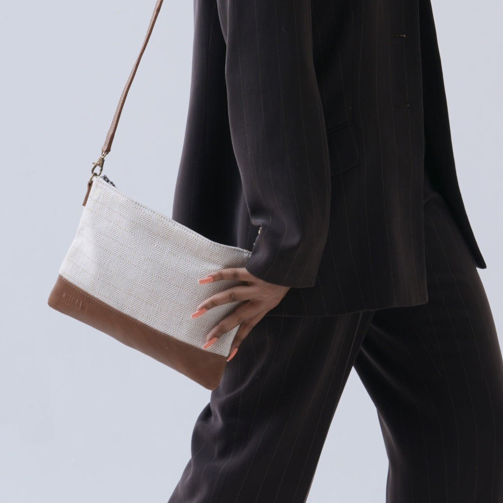 Chiban beige cross body bag on model walking