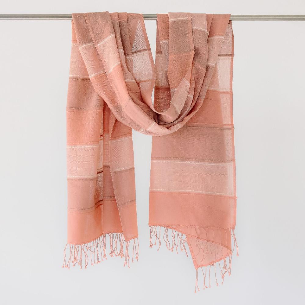 Danakil shawl in blush on a bar.