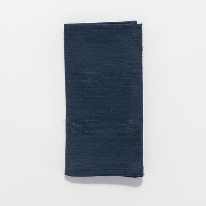 Flat lay of Rift Valley cocktail napkin in navy