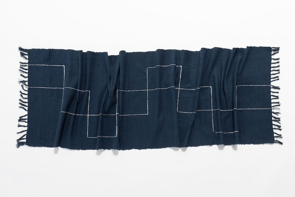 Full design of Rift Valley table runner in navy on white background