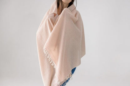 Judith shawl in blush wrapped around model