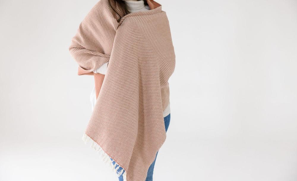 Maya shawl in blush on a female model with white background