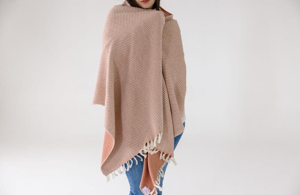 Maya shawl in blush on a model