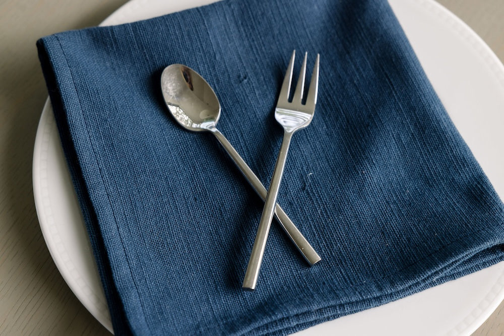 Navy Semien cocktail napkin with fork and spoon