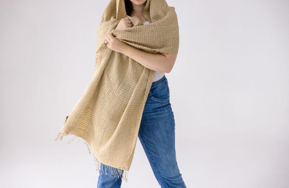 Queen Saba pure shil shawl in beige on a female model. 