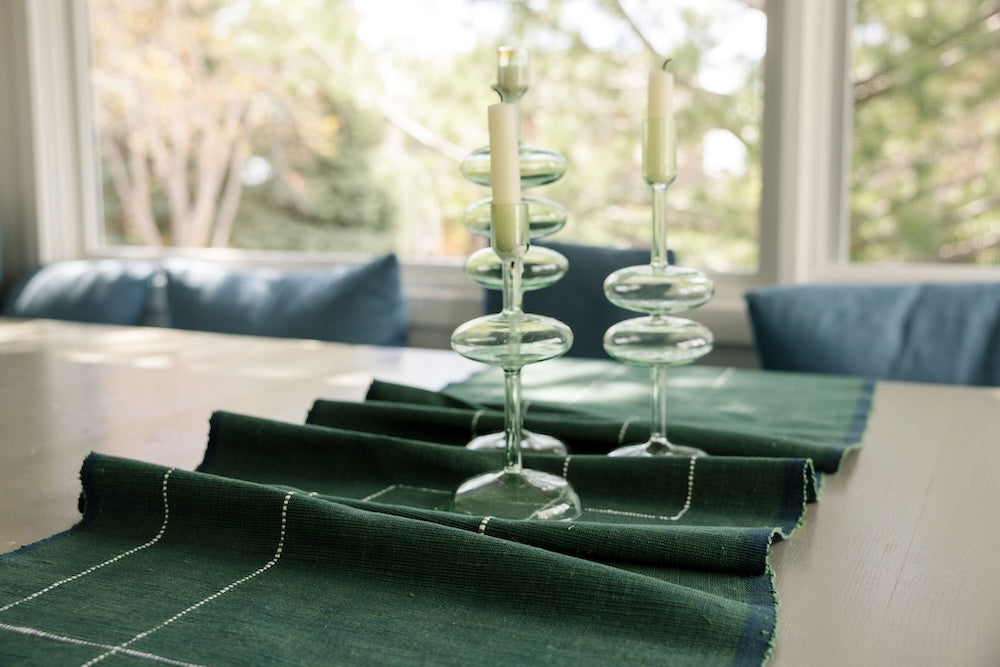 Rift Valley table runner in cedar on a table with candle sticks