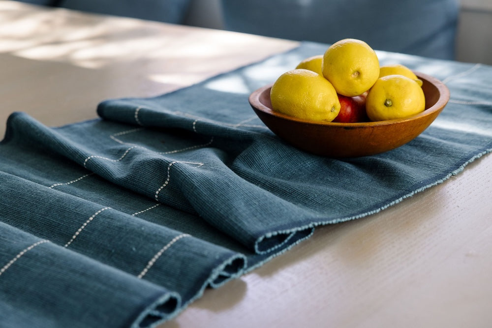 Rift Valley table runner in flax with a bowl of lemons