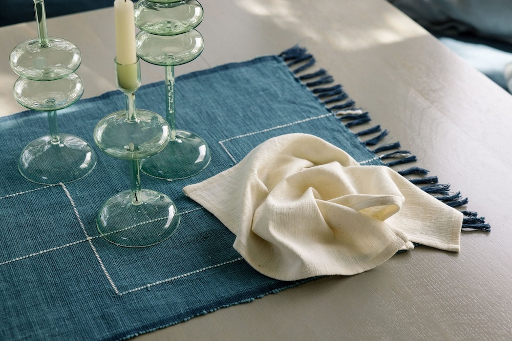 Rift Valley table runner flax with ivory Simien cocktail napkin on table