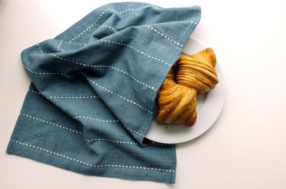 Rift Valley tea towel flax with croissant on a plate