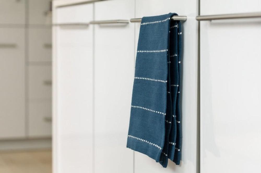 Rift Valley tea towel navy hanging