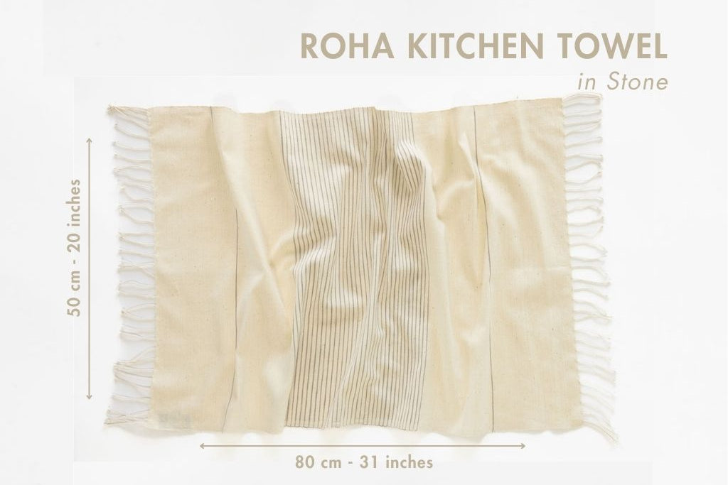 Roha kitchen towel in stone with fringes and dimensions on a white background