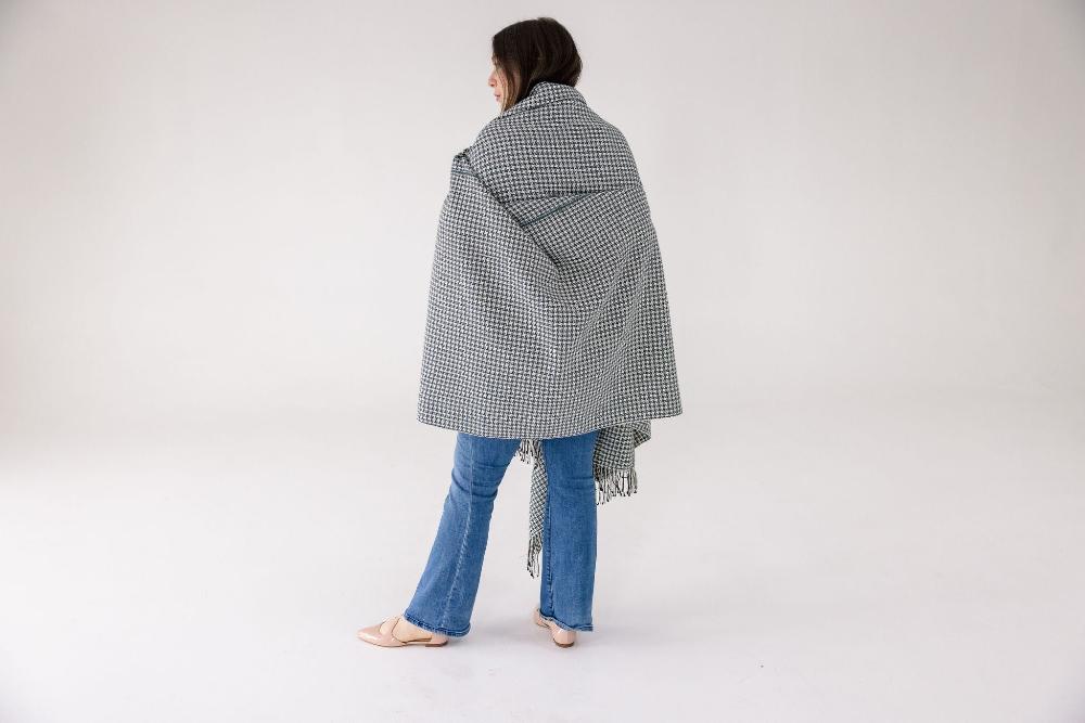 Sitota throw blanket on model from behind on a white background