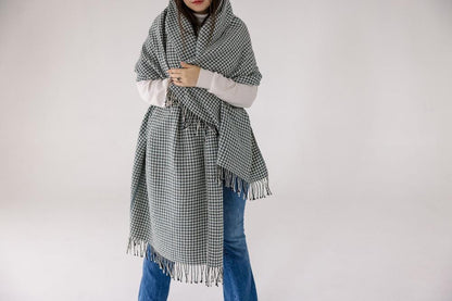 Sitota throw blanket wrapped around a model on a white background