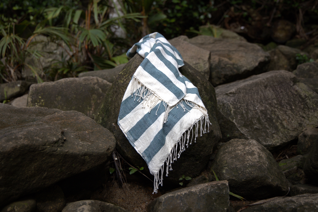 Striped omo towel on a rock with a natural background