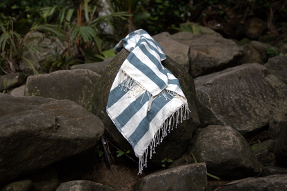 Striped omo towel on a rock with a natural background