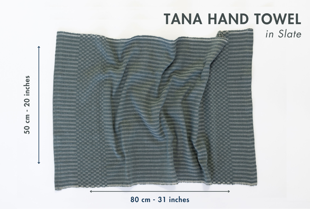 Tana hand towel in slate color with dimensions on a white background