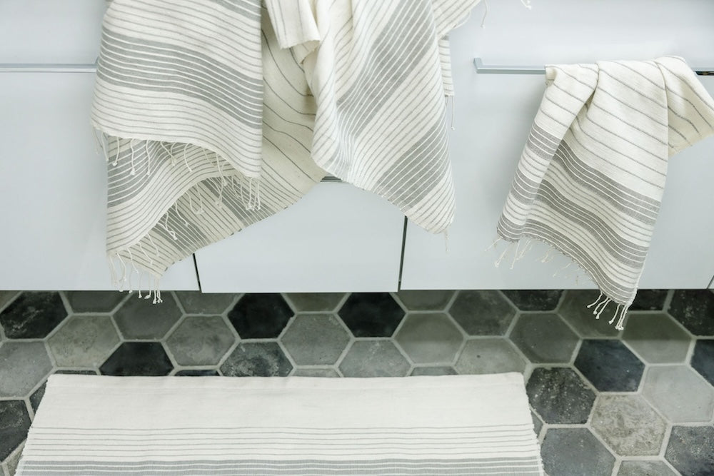 Teka hand and bath towel in stone in bathroom