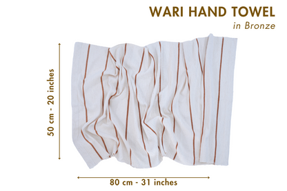 Wari hand towel in bronze with dimensions on a white background