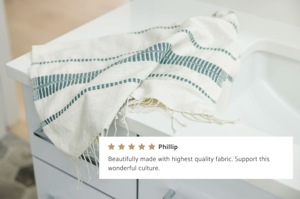 abaya hand towel in bathroom with customer review