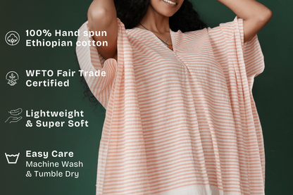 ari kaftan in salmon with key features with green background