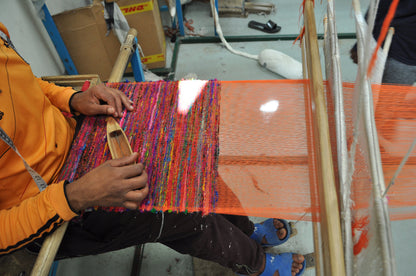 artisan weaving harar runner on traditional loom