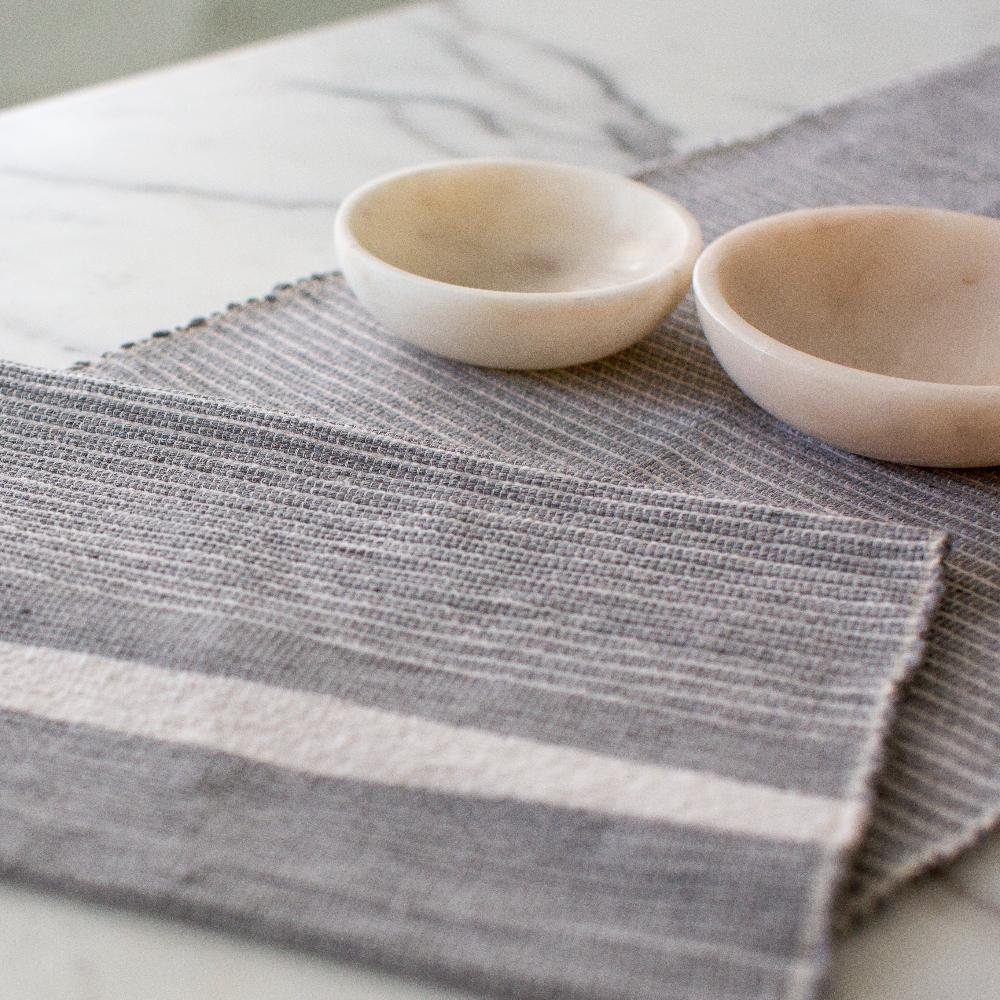 close up of Adwa table runner in light grey