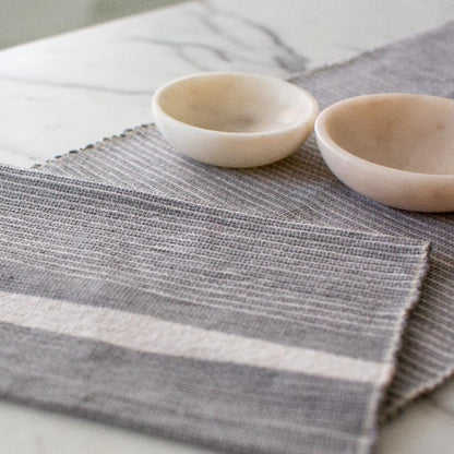 close up of Adwa table runner in light grey