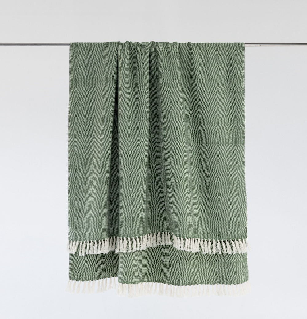 Mechot throw blanket in mint on bar with white background