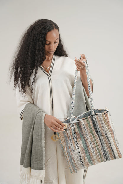 petra kaftan in black on ethiopian model with fasika bag and abay towel