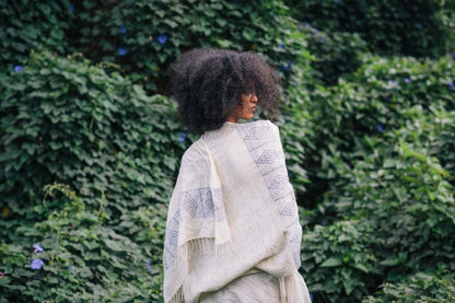 queen menon shawl wrapped around model in nature